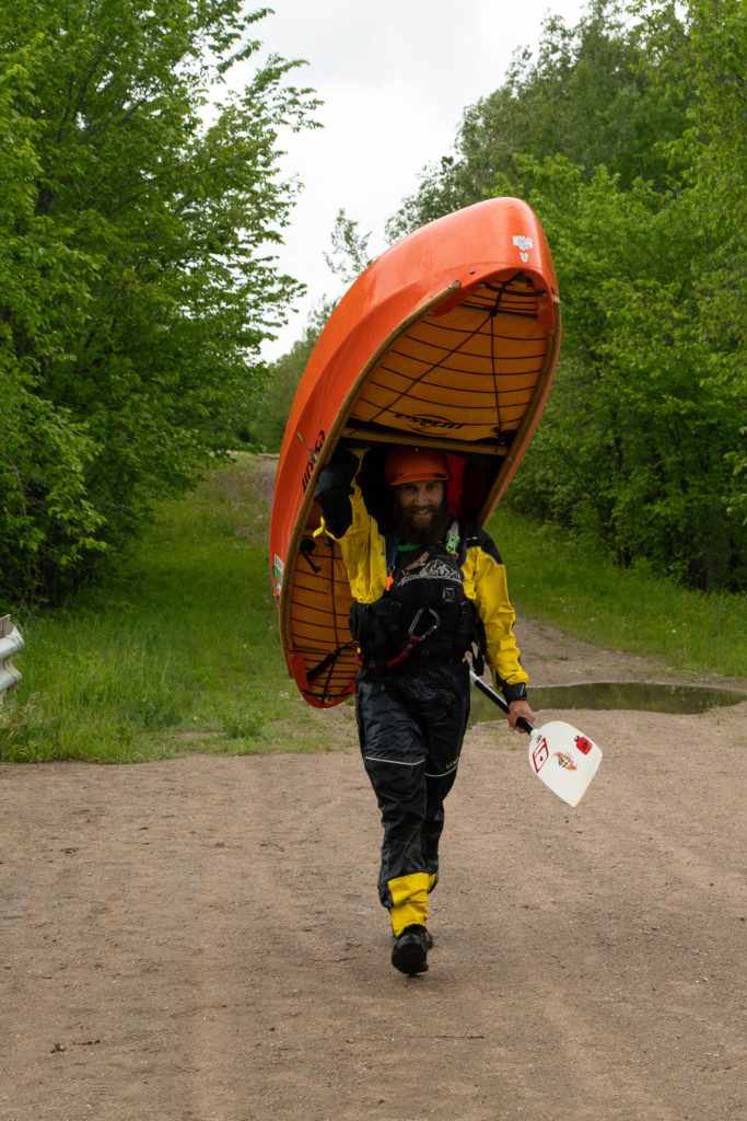 Man carrying canoe